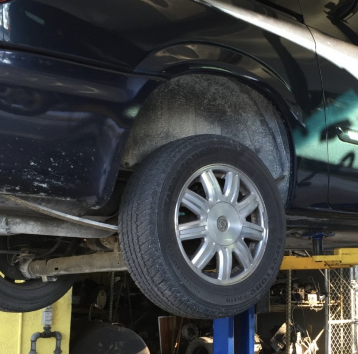 vehicle on a lift being repaired